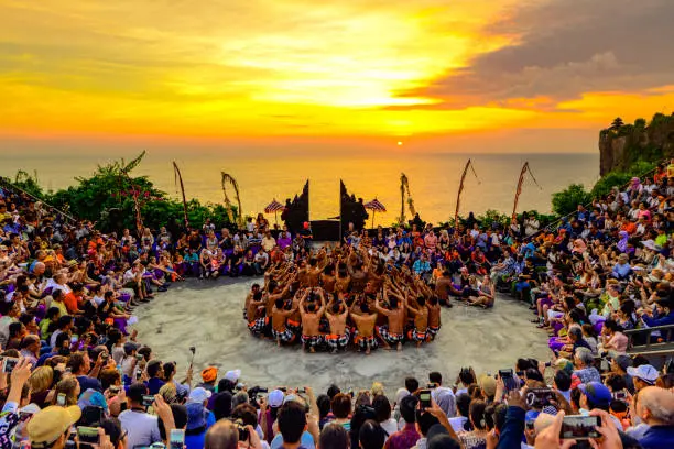 A traditional Kecak dance performance at sunset, a highlight of Bali's cultural heritage.