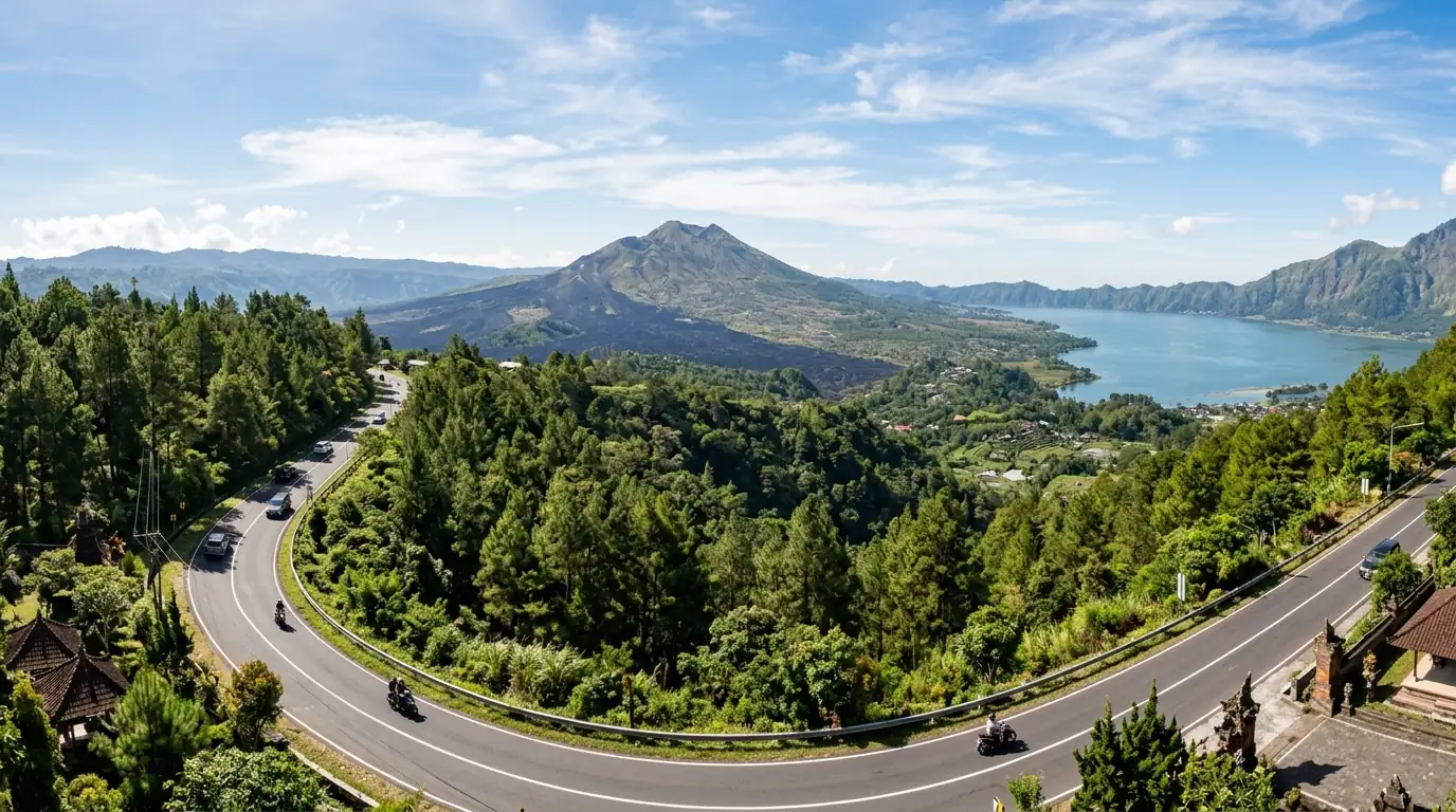 Kintamani volcano tour route in Bali — winding scenic mountain highway overlooking Mount Batur and the caldera lake.