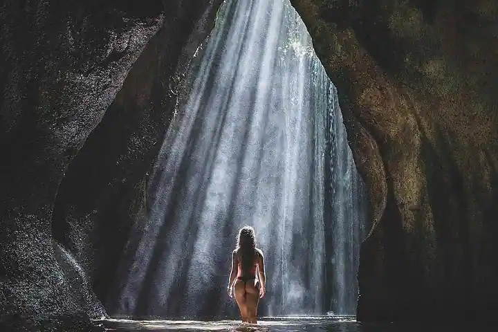 A hidden waterfall in the Bali jungle, perfect for a refreshing nature escape.