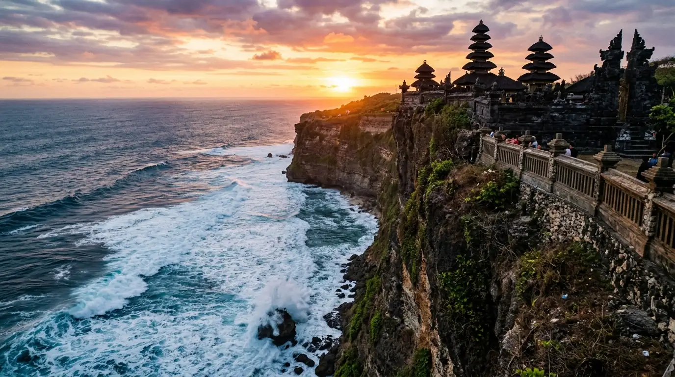 Uluwatu Temple cliff sunset view Bali — dramatic Hindu sea temple perched 70 meters above the Indian Ocean.